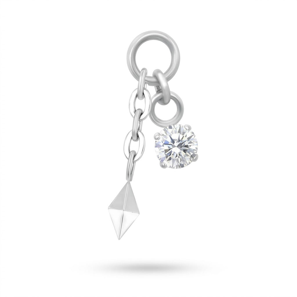 Charm in titanio per piercing con cristallo e pendente geometrico. Personalizza cerchietti e gioielli compatibili con spessore o filettatura da 1,2 mm.