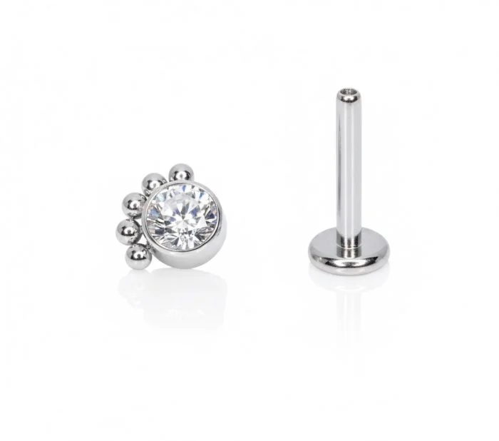 Piercing a Fiore Solare (Sunny) in titanio, petali di zirconi a formare una corona