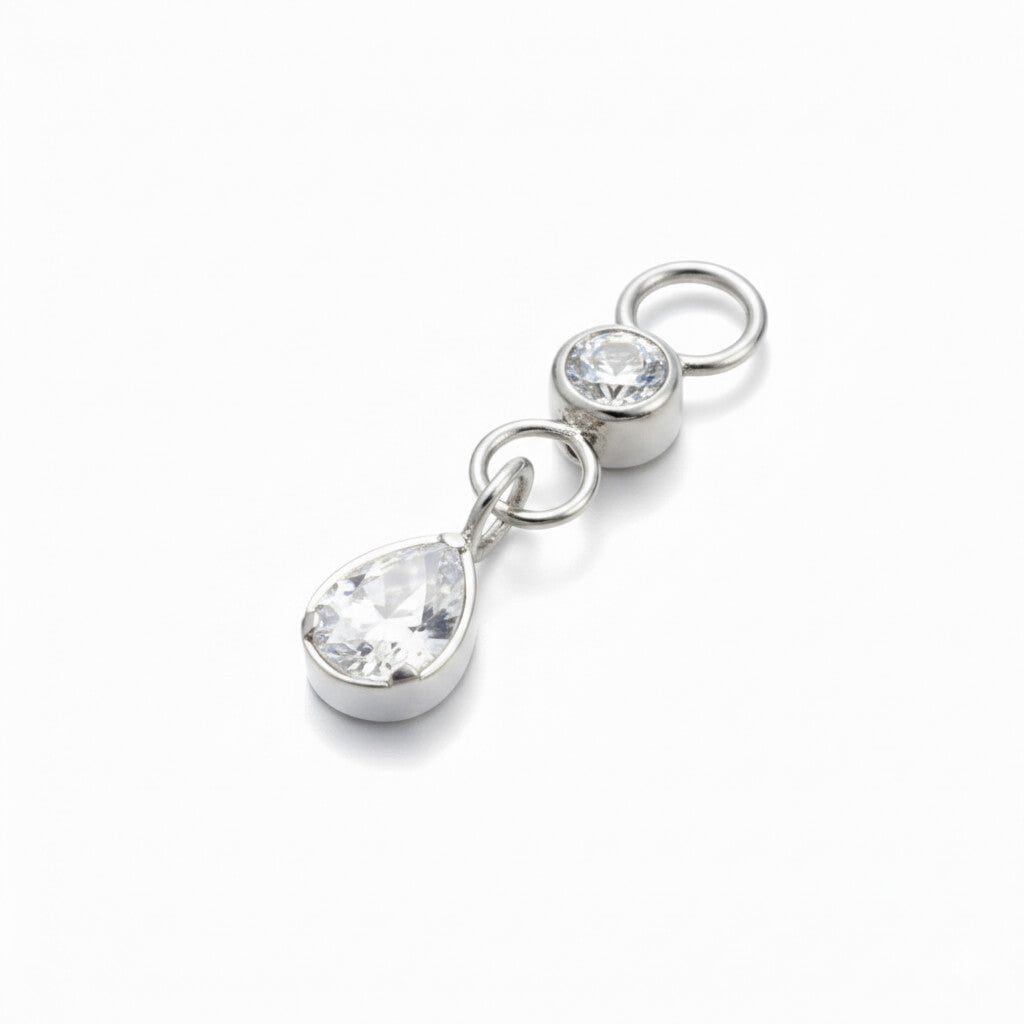 charm piercing titanio due cristalli zirconi pendenti
