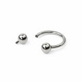 Piercing a ferro di cavallo (circular barbell) in titanio di grado implantare, con palline a vite. Anello base ipoallergeni. Disponibile in diverse misure.
