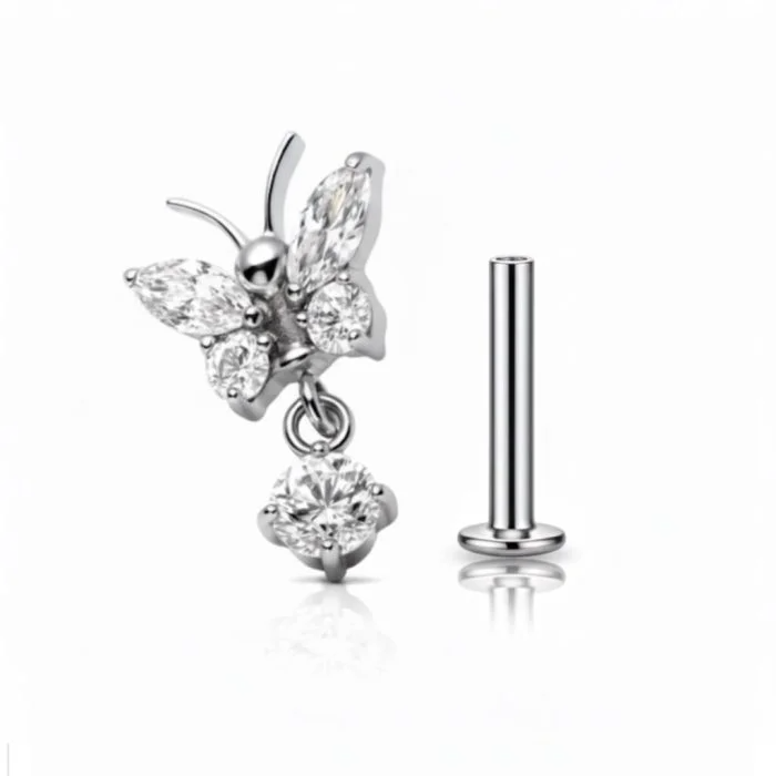 Piercing in titanio ipoallergenico Butterfly Drop, design delicato a farfalla ideale per look femminili e luminosi.