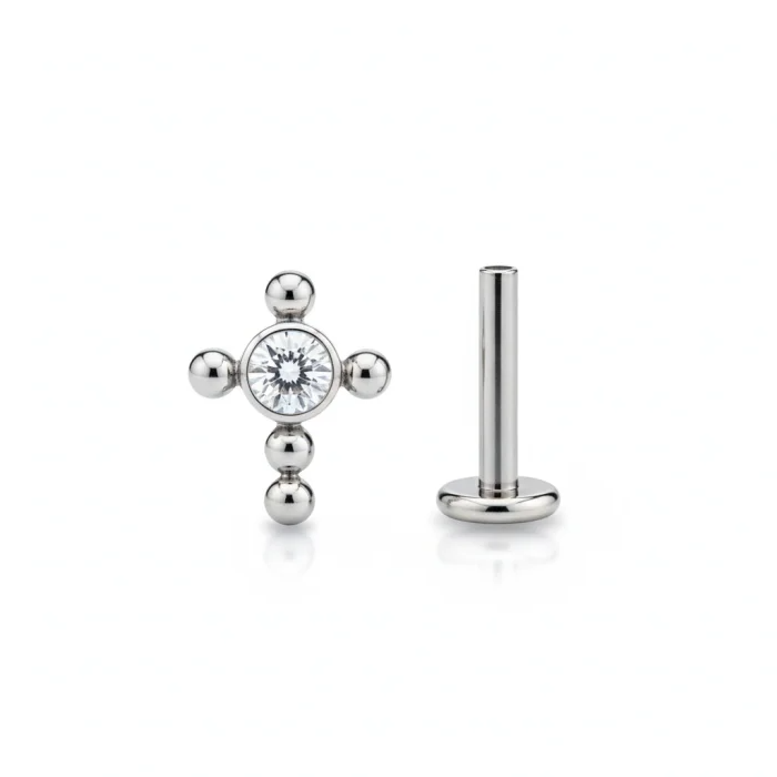 Gioiello piercing a forma di croce semplice in titanio anallergico.