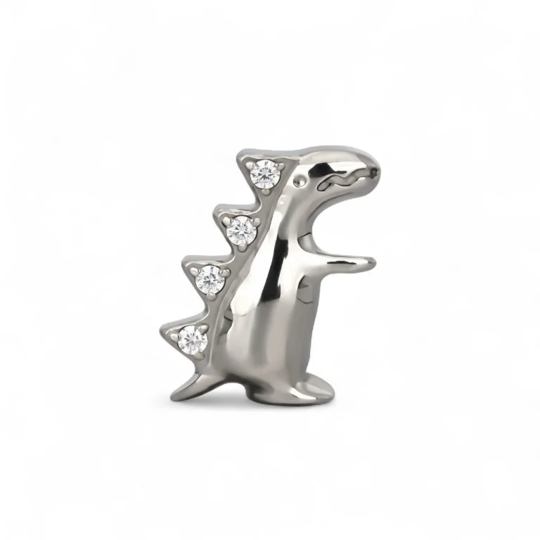 Gioiello piercing in titanio con piccolo dinosauro, elegante e adatto a look originali su helix e lobo.