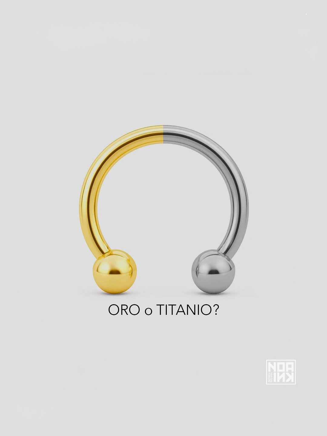 Piercing a cerchio metà oro e metà titanio: confronto tra materiali per gioielli da piercing.