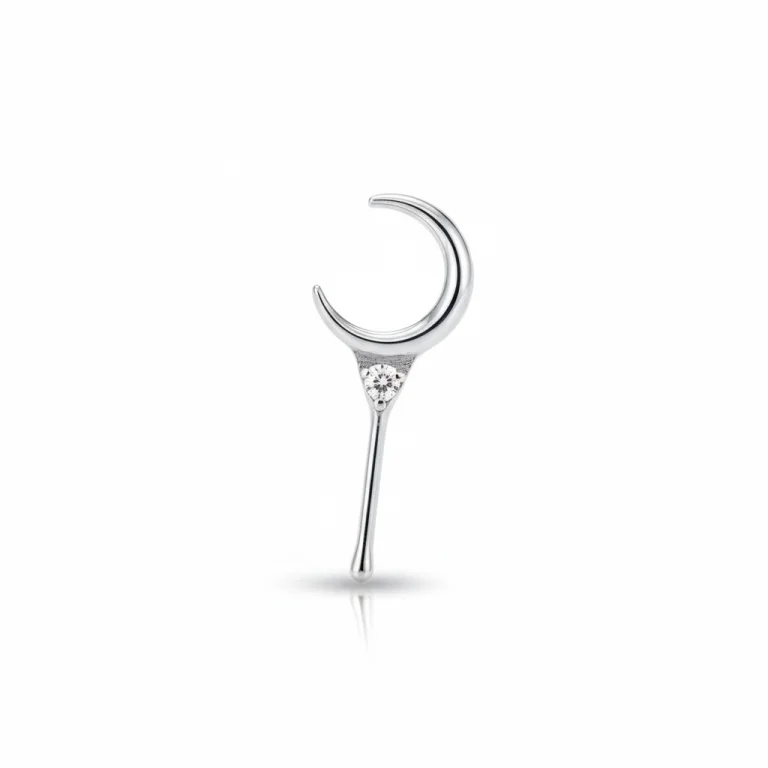 Piercing simbolico Luna Crescente e Stella in titanio di grado implantare ASTM F136. Gioiello con design cosmico.